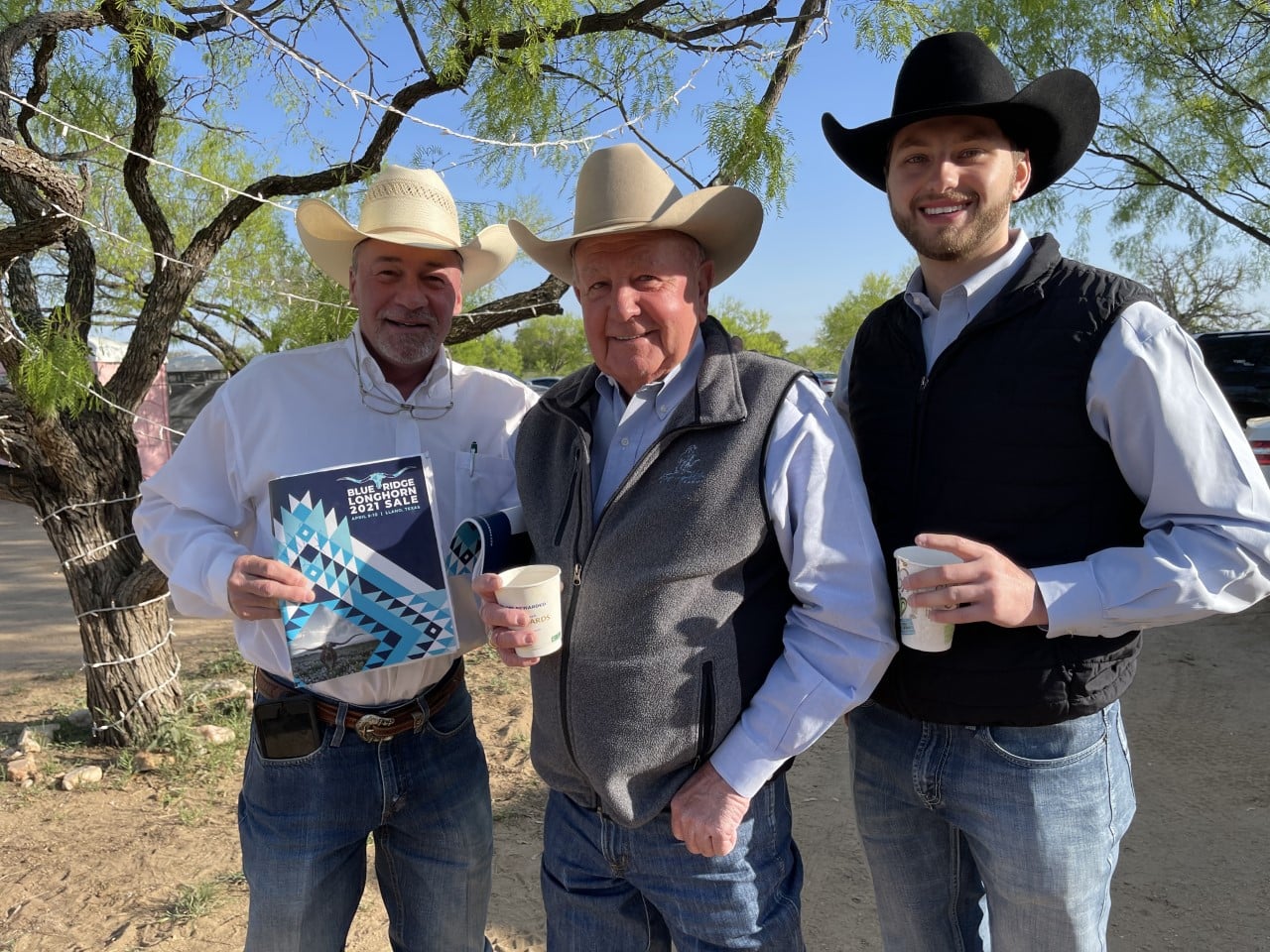 Hired Hand customer Dale Hunt, Rockin H Longhorns with the auction crew