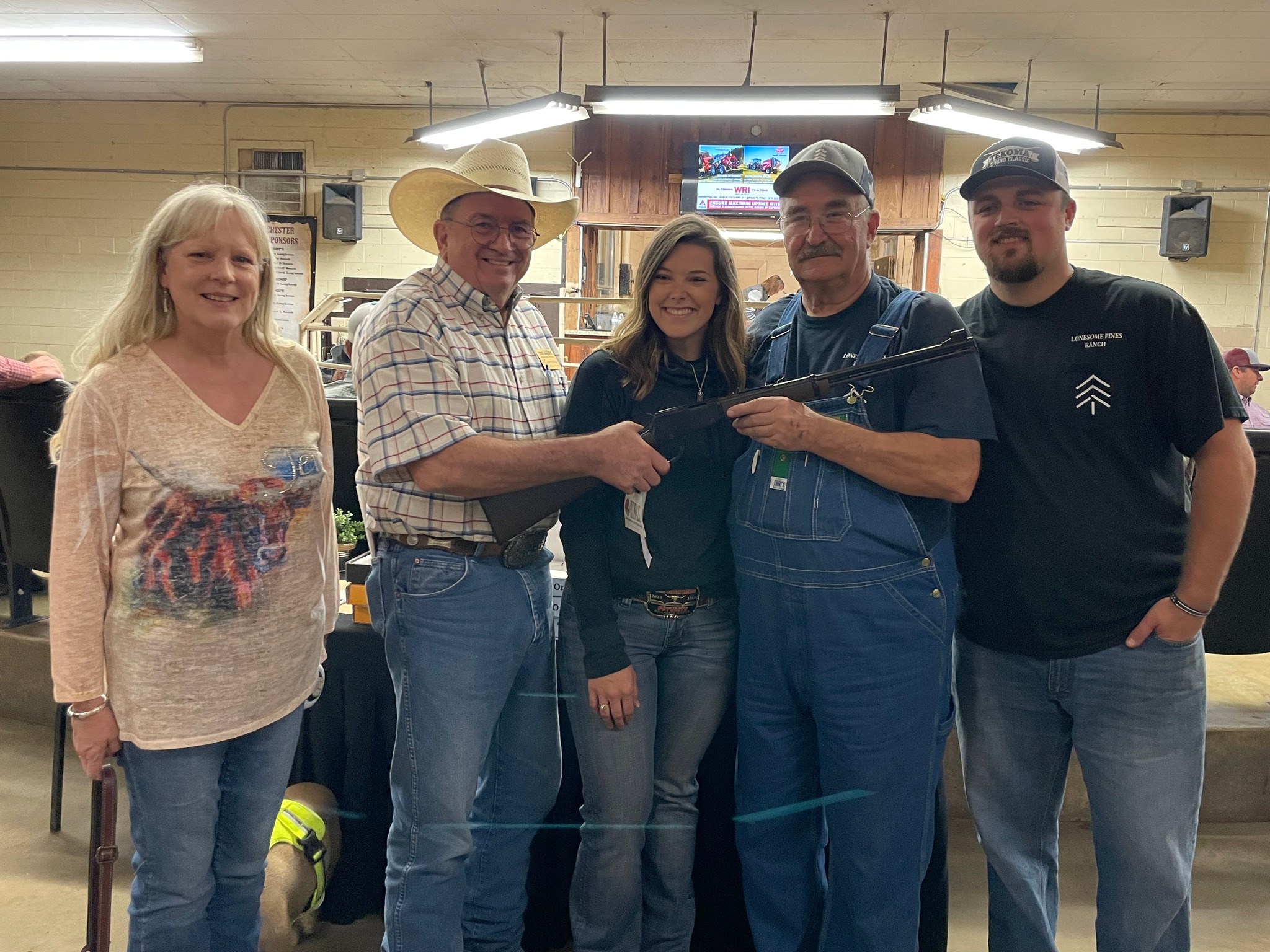 Hired Hand customers and Rifle Winners John Randolph, Dylan and Miranda Skarpa, Lonesome Pines Ranch with Tina Du Bose and TLBAA Chairman of the Board Keith Du Bose