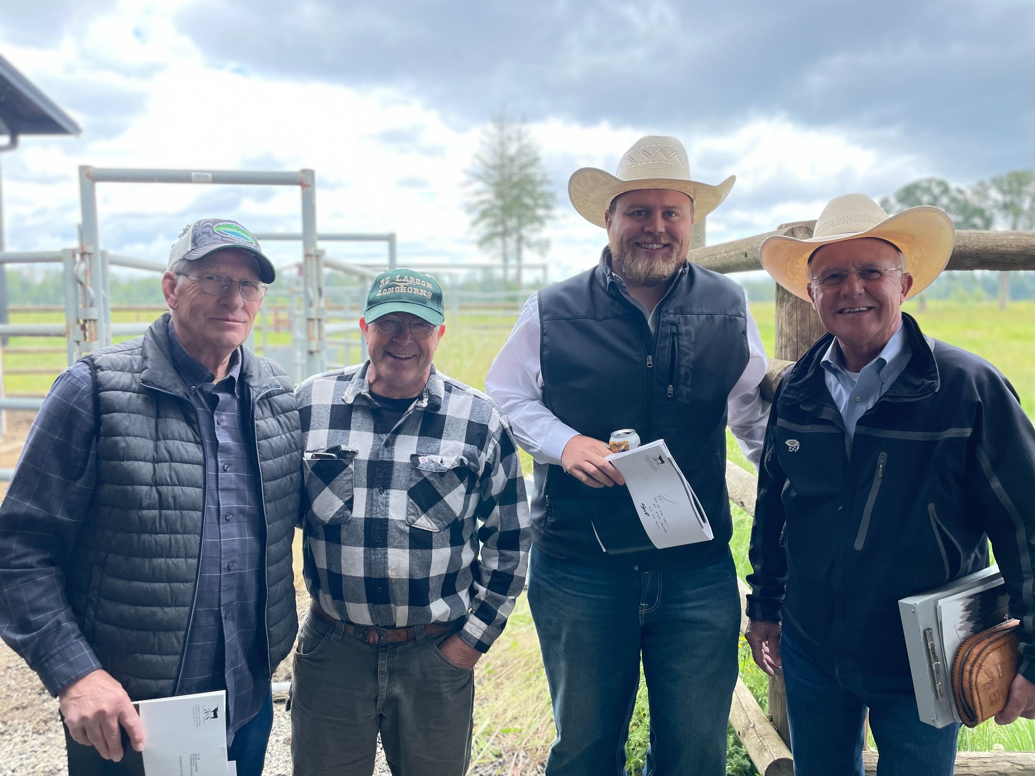 Hired Hand customers Bob Larson, RC Larson Longhorns; Chase Vasut, Rockin AF Ranch, and Auctioneer Bruce McCarty, Bruce McCarty Promotions