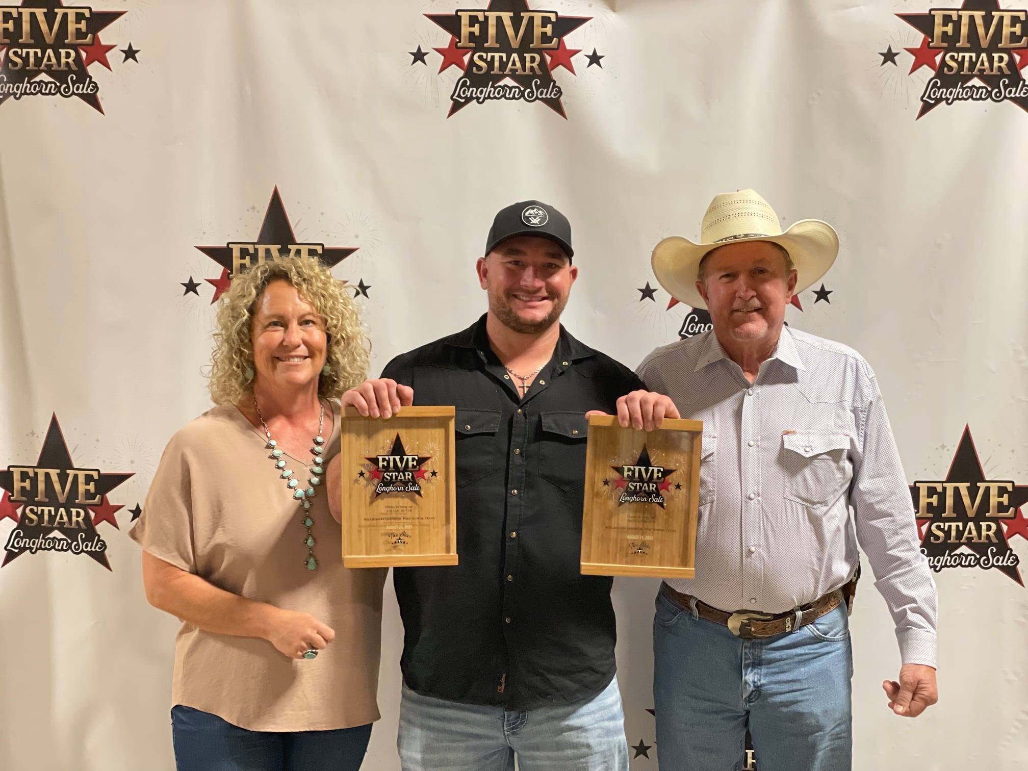 Sale Hosts and Hired Hand customers Brent and Cindy Bolen with Volume Buyer and Highest Bidder, Austin Rohr