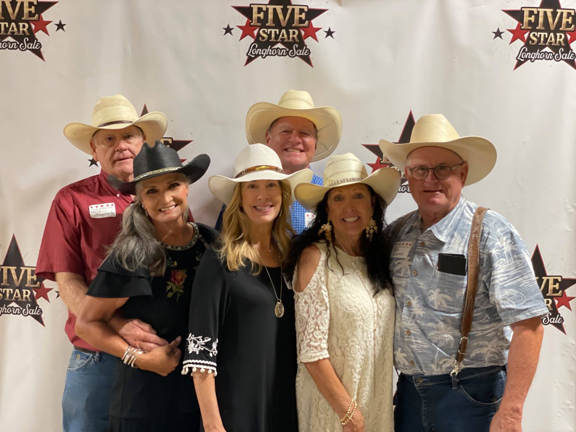 Sale Hosts and Hired Hand customers Larry & Toni Stegemoller, TL Longhorns; Brian and Suzanne Brett, Brett Ranch; Bob and Pam Loomis, Loomis Ranch