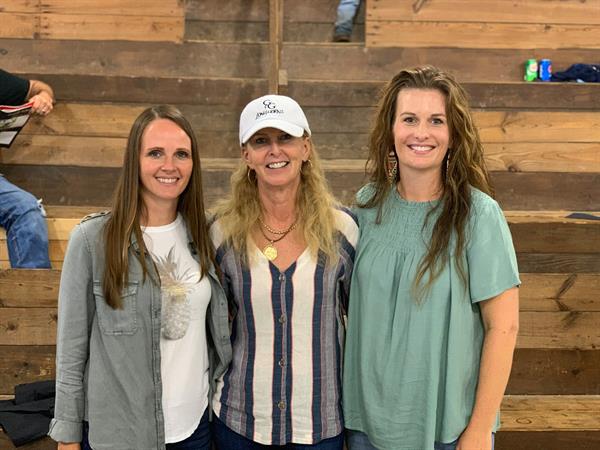 Hired Hand&#39;s Jaymie and Molly with sale host and customer Ann Gravett, G&amp;G Longhorns.